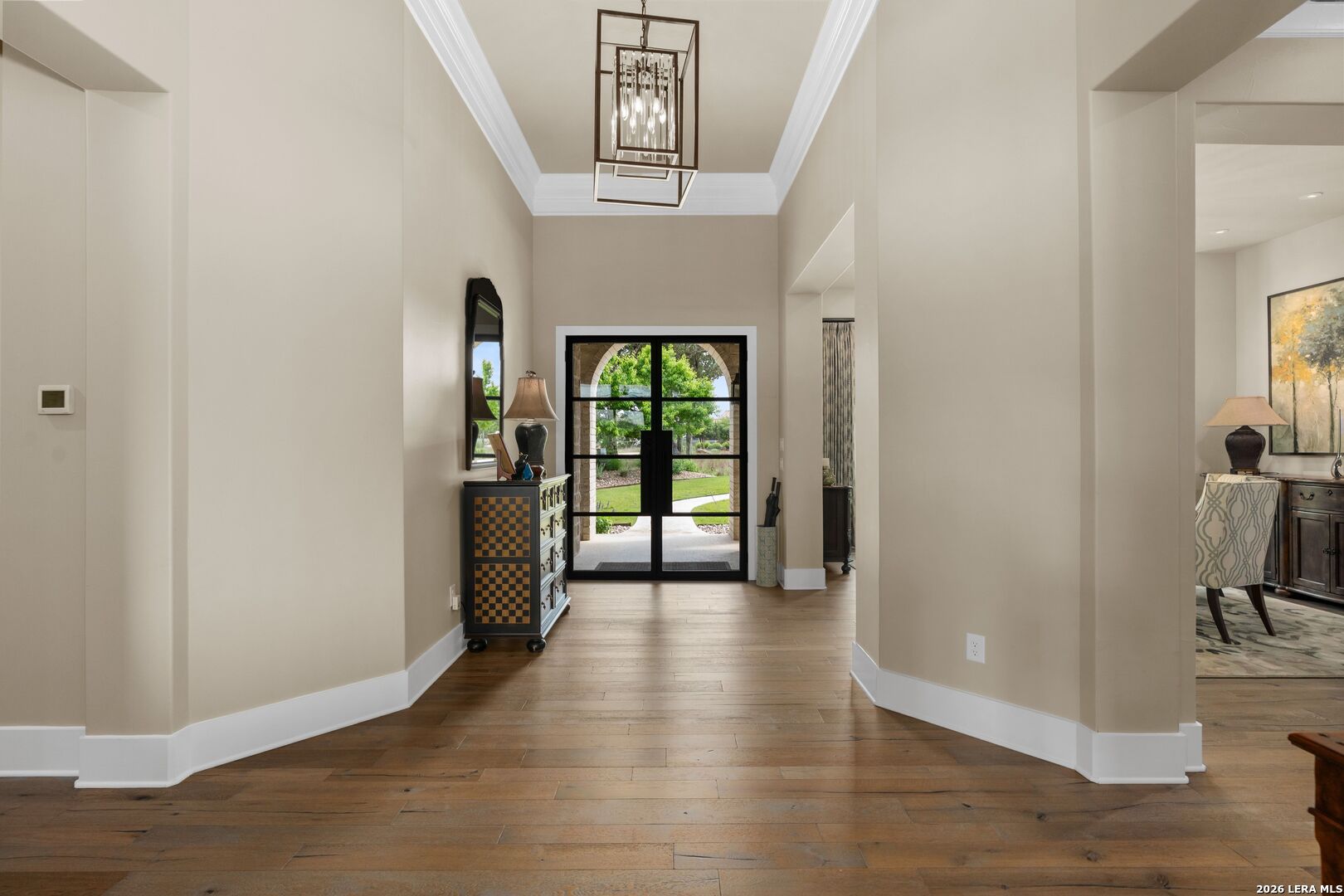 52 Landmark Ridge Bergheim, TX 78004 - Photo 7 of 24 a view of a hallway with wooden floor and a living room