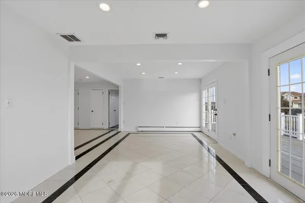 a kitchen with stainless steel appliances kitchen island granite countertop a stove and a sink