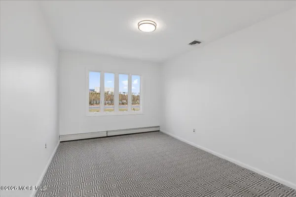 a bathroom with a toilet a sink and shower