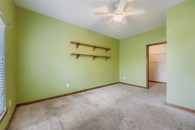 an empty room with a fan