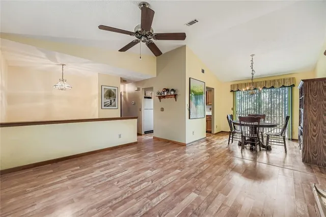 a view of a room with furniture and a wooden floor