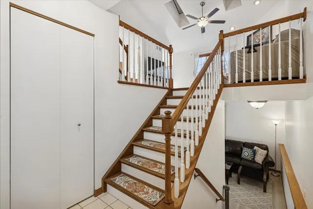 a view of entryway with wooden floor and stairs