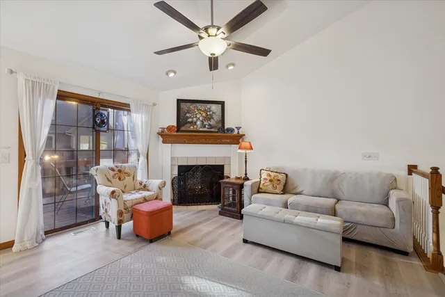 a living room with furniture and a fireplace