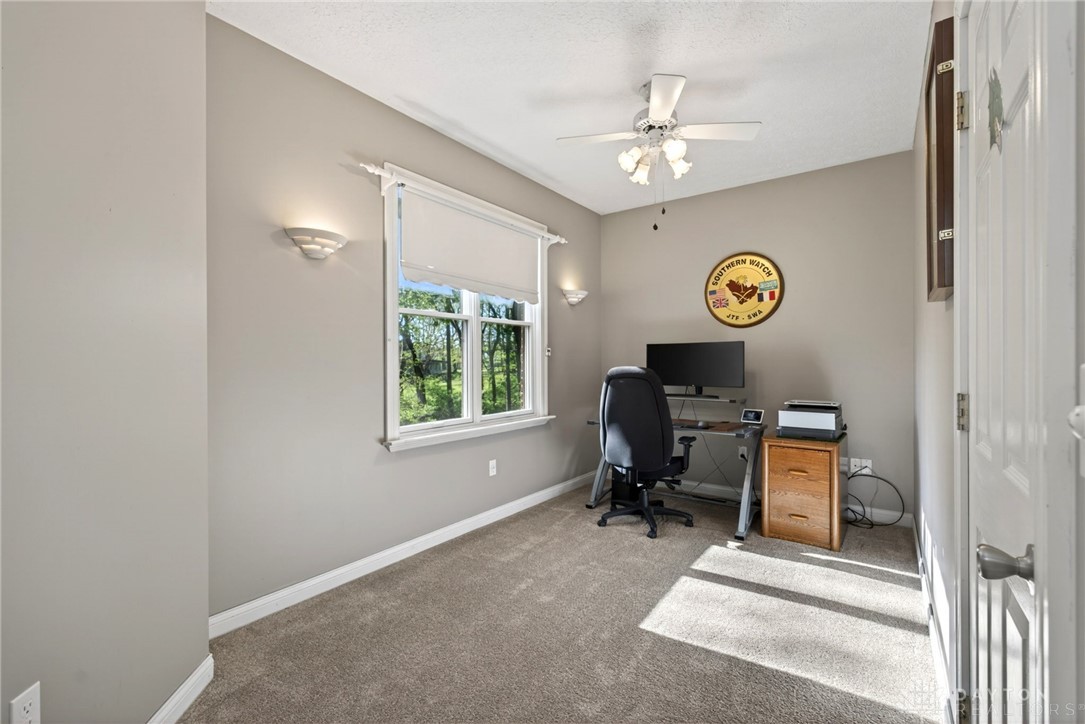 330 South Alpha Bellbrook Road Bellbrook, OH 45305 - Photo 21 of 87 Bright and inviting space perfect for an office, featuring a window overlooking lush greenery.