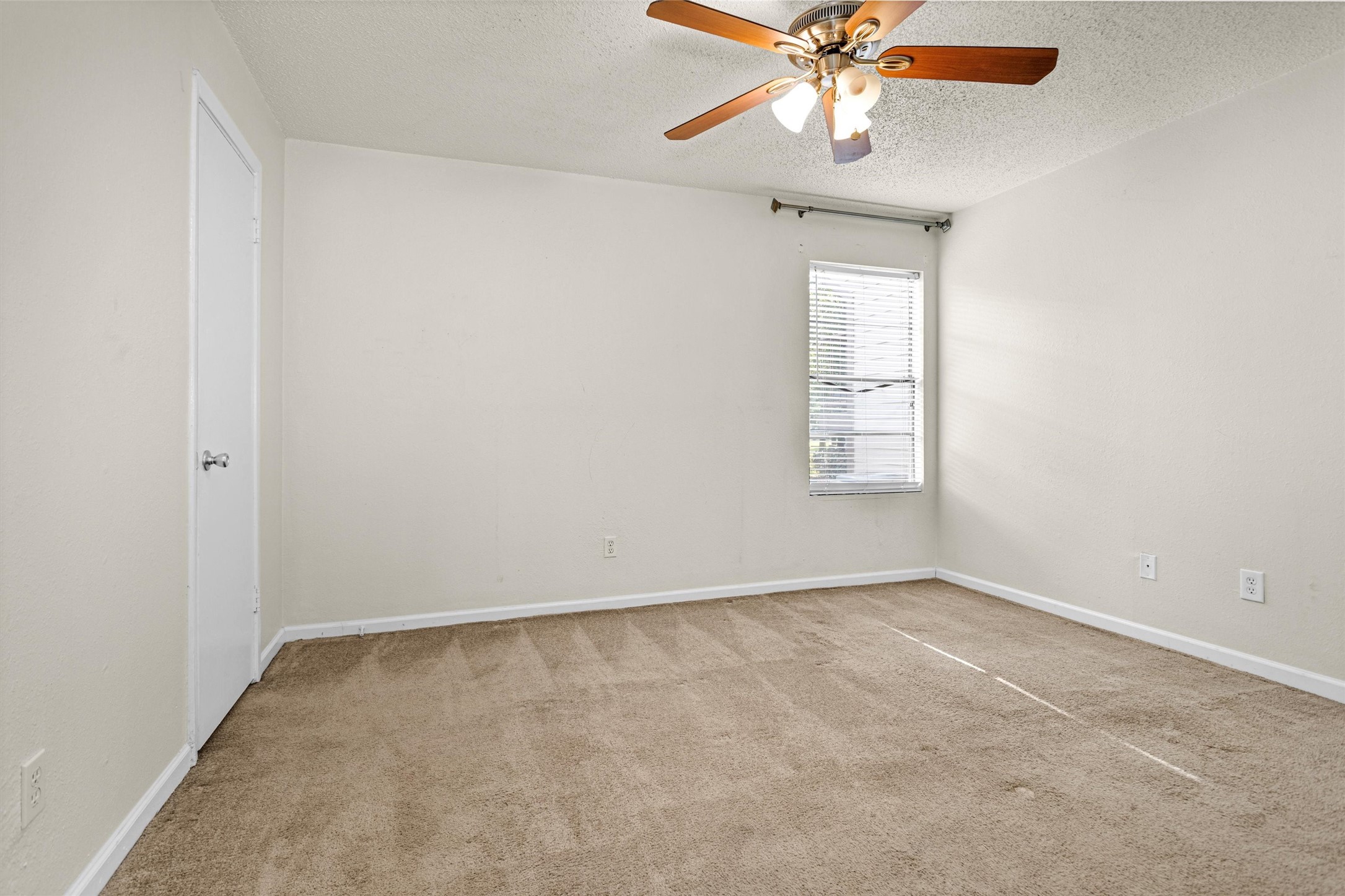 12900 Walden Road, Unit 513 Montgomery, TX 77356 - Photo 14 of 20 an empty room with windows and fan