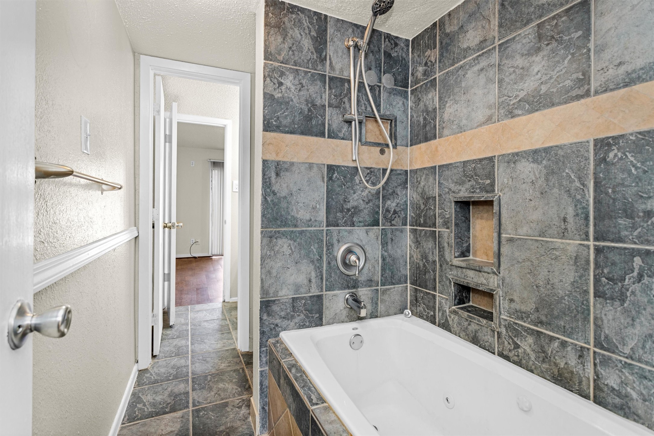 12900 Walden Road, Unit 513 Montgomery, TX 77356 - Photo 15 of 20 a bathroom with a bathtub and shower