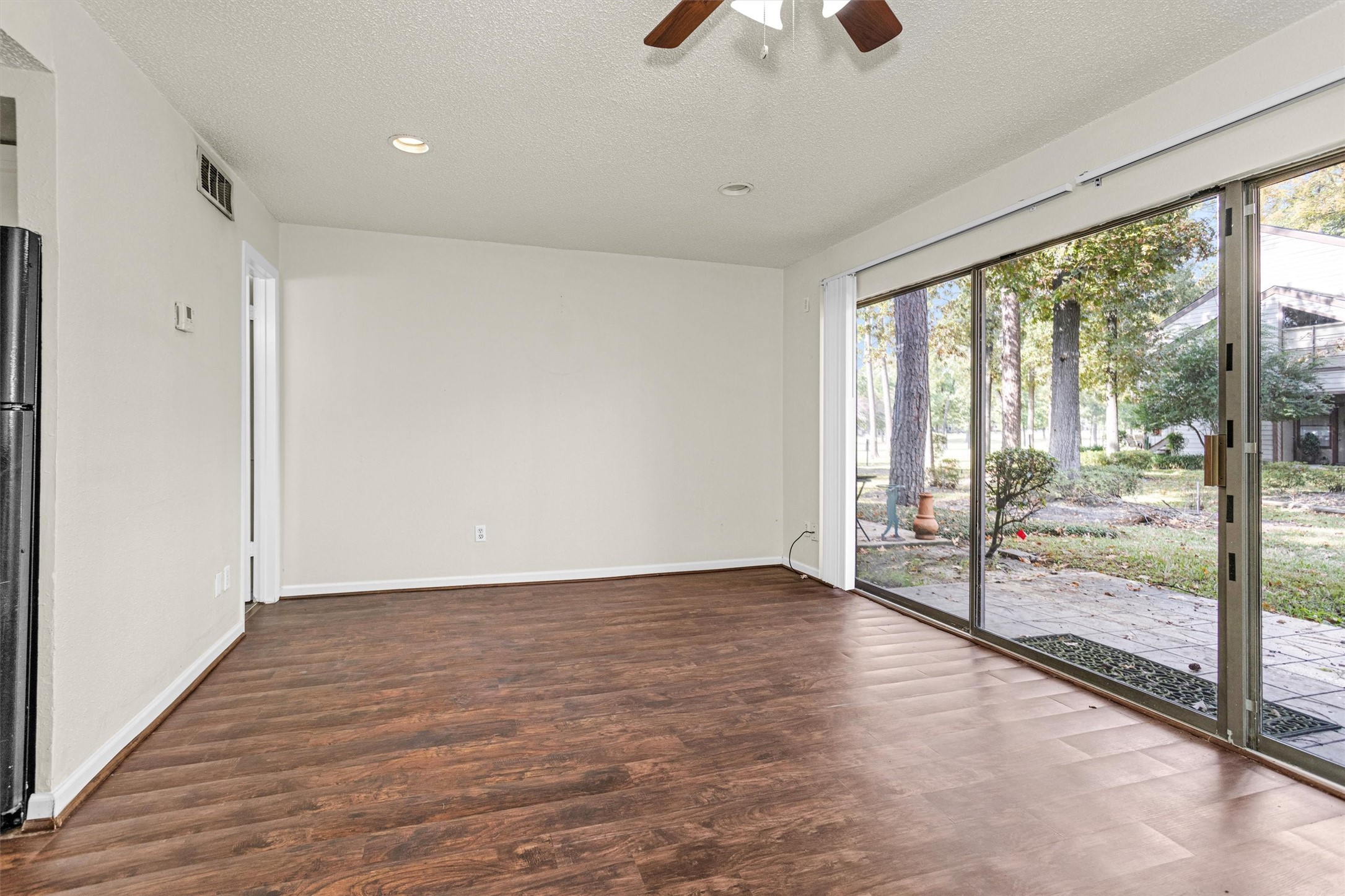 12900 Walden Road, Unit 513 Montgomery, TX 77356 - Photo 8 of 20 a view of an empty room with glass door