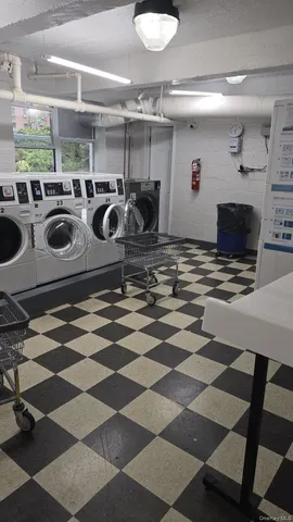 a kitchen with a stove a sink and a refrigerator