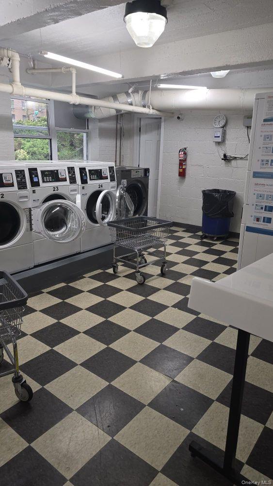 64-35 Yellowstone Boulevard, Unit 6H Queens, NY 11375 - Photo 3 of 6 a kitchen with a stove a sink and a refrigerator