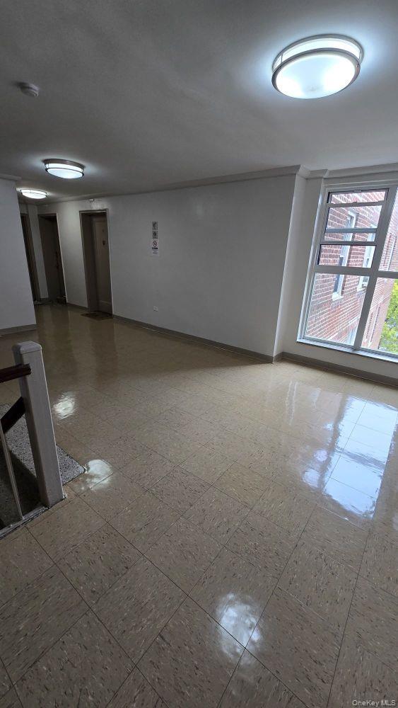 64-35 Yellowstone Boulevard, Unit 6H Queens, NY 11375 - Photo 6 of 6 a view of an empty room with a window