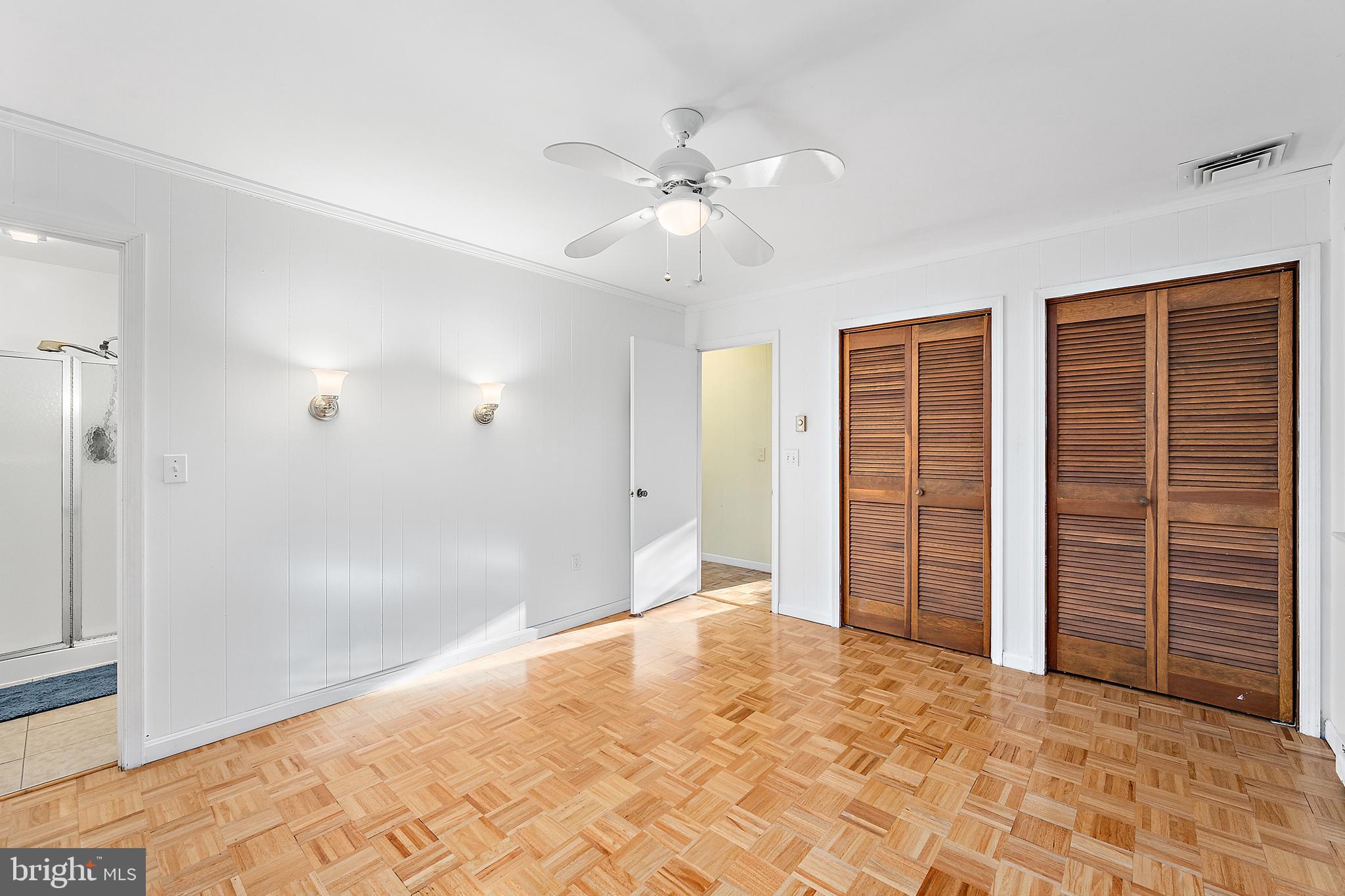 6181 Rockawalkin Road Salisbury, MD 21801 - Photo 46 of 65 wooden floor in an empty room with a bathroom