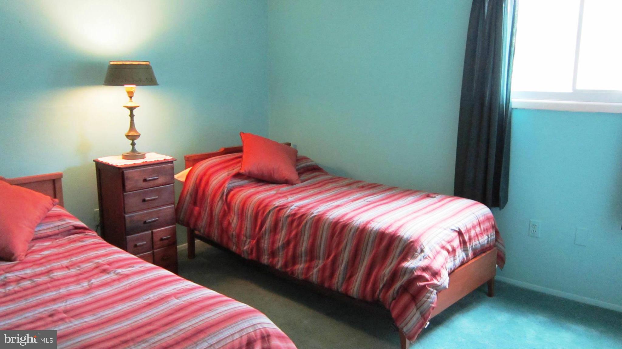 17030 Hughes Road Poolesville, MD 20837 - Photo 13 of 24 a bedroom with a bed and a lamp