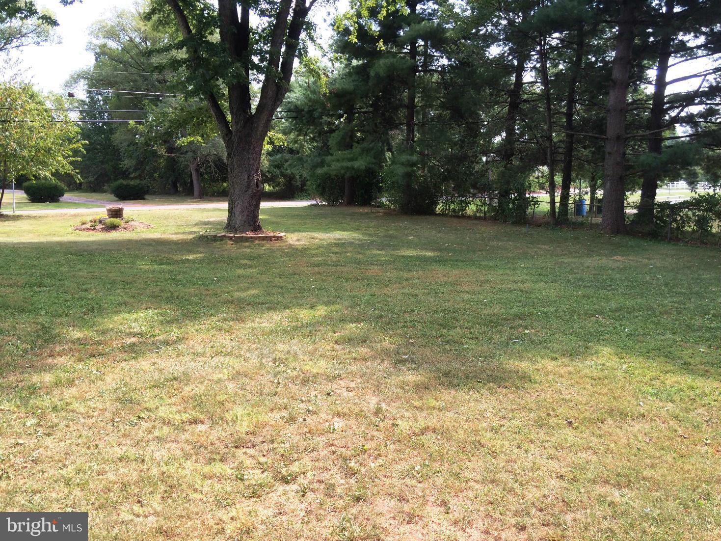17030 Hughes Road Poolesville, MD 20837 - Photo 21 of 24 a view of outdoor space with trees all around