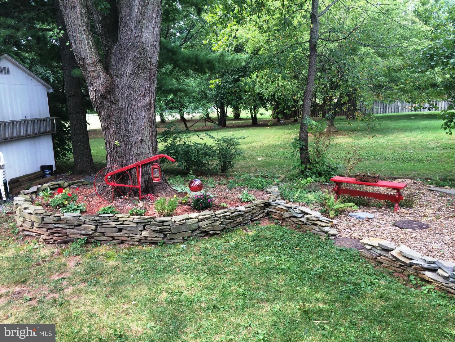 17030 Hughes Road Poolesville, MD 20837 - Photo 23 of 24 a view of a park with large trees and a yard