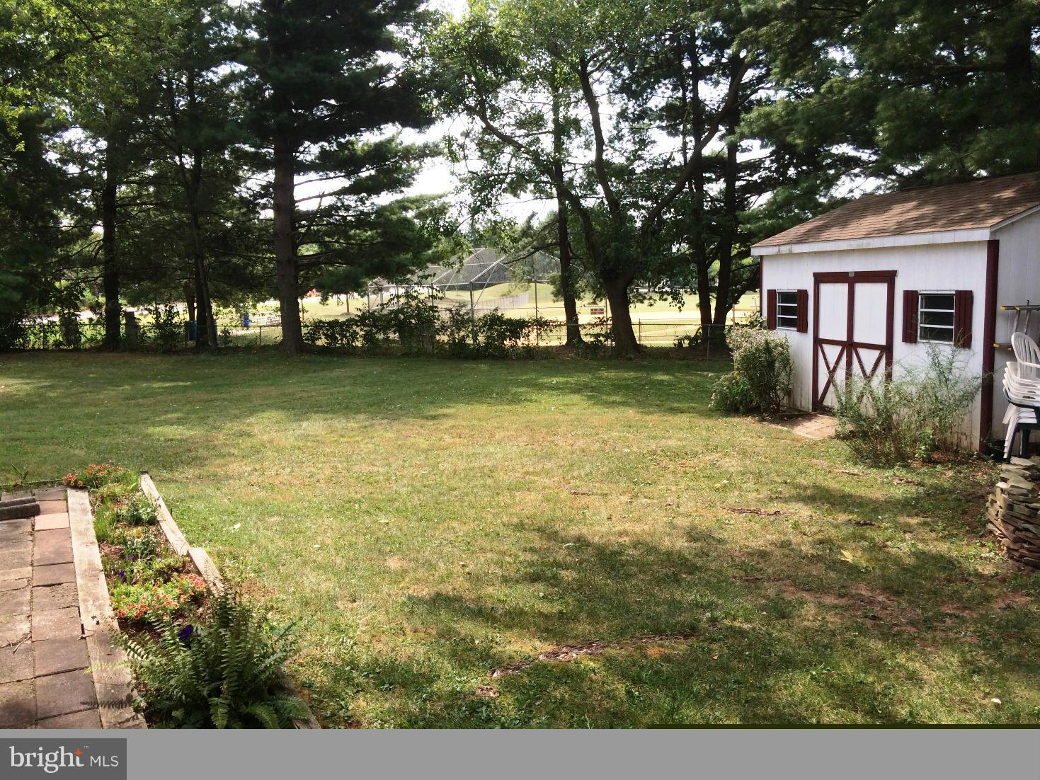 17030 Hughes Road Poolesville, MD 20837 - Photo 24 of 24 a view of a yard with plants and large trees