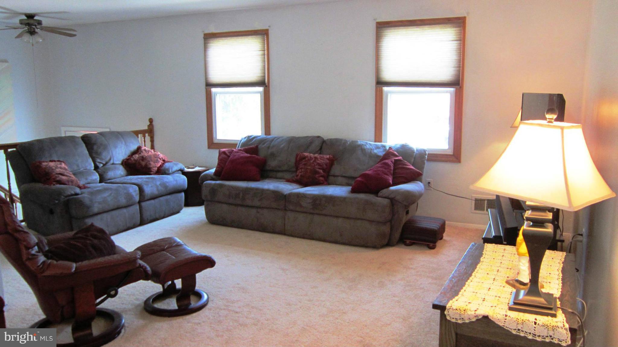 17030 Hughes Road Poolesville, MD 20837 - Photo 7 of 24 a living room with furniture and a window