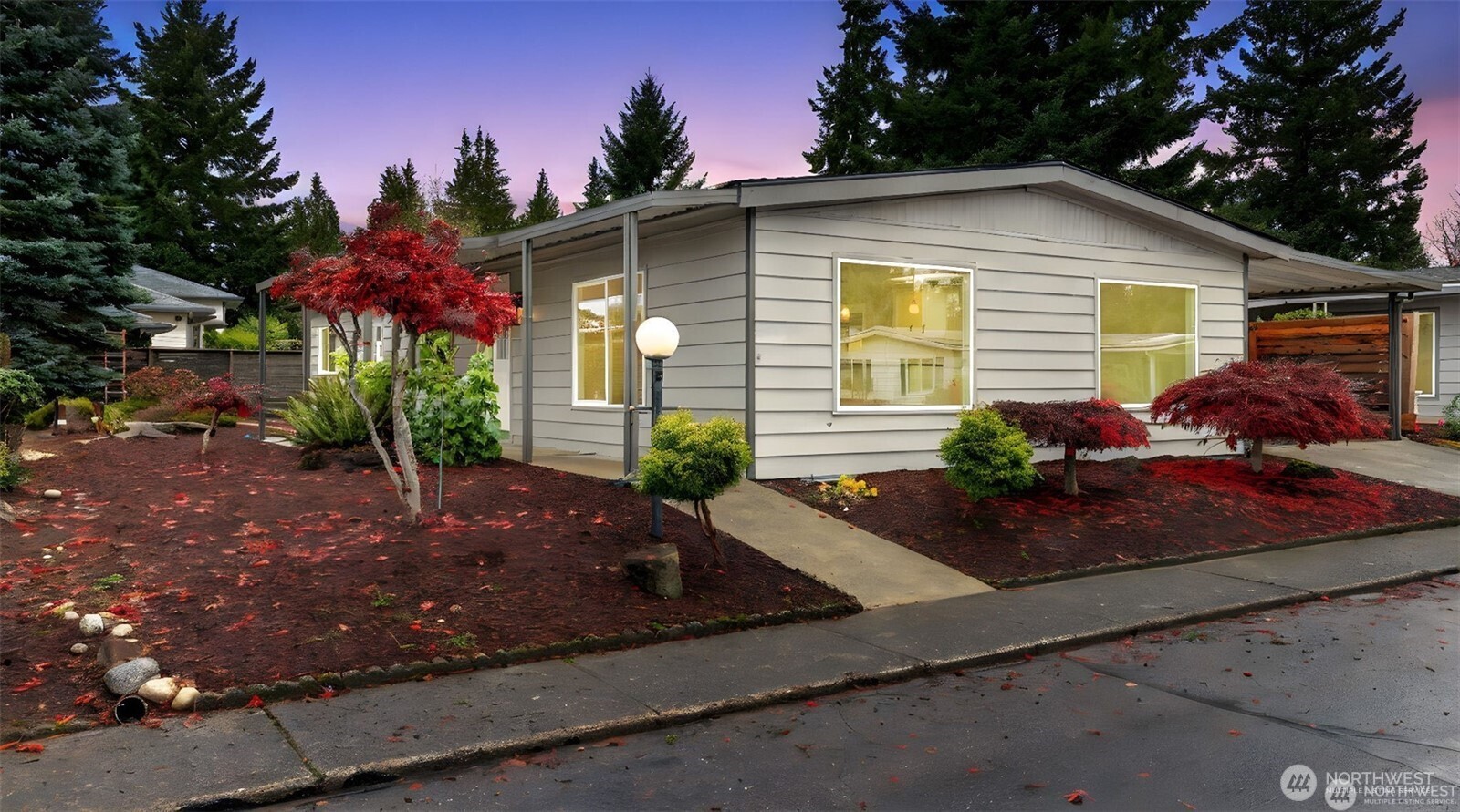 201 Union Avenue Southeast, Unit 247 Renton, WA 98059 - Photo 1 of 32 a front view of a house with garden