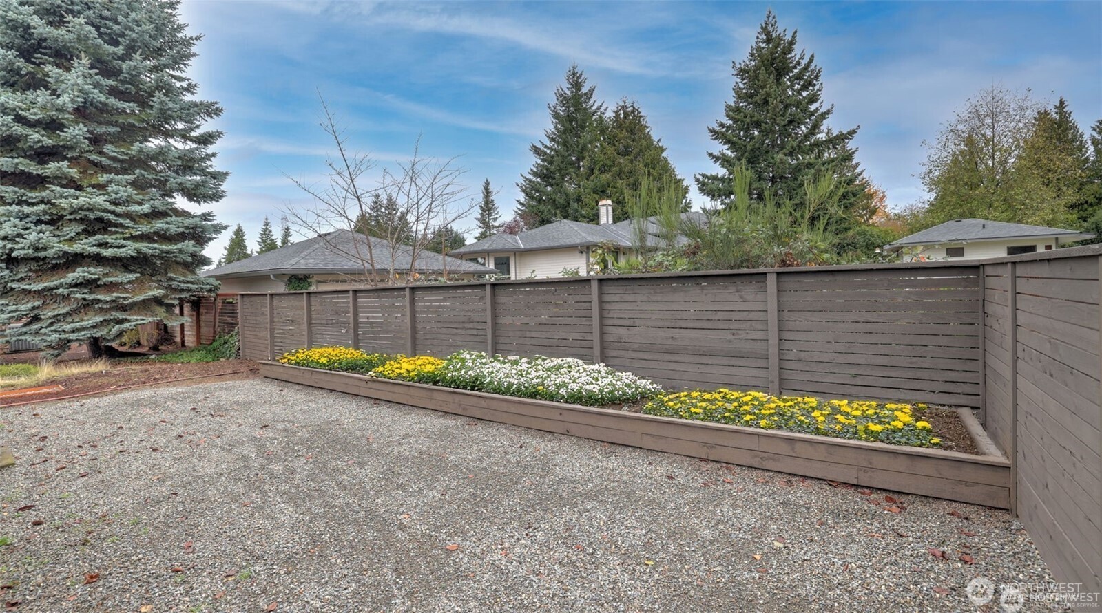 201 Union Avenue Southeast, Unit 247 Renton, WA 98059 - Photo 9 of 32 a view of a backyard with a bench