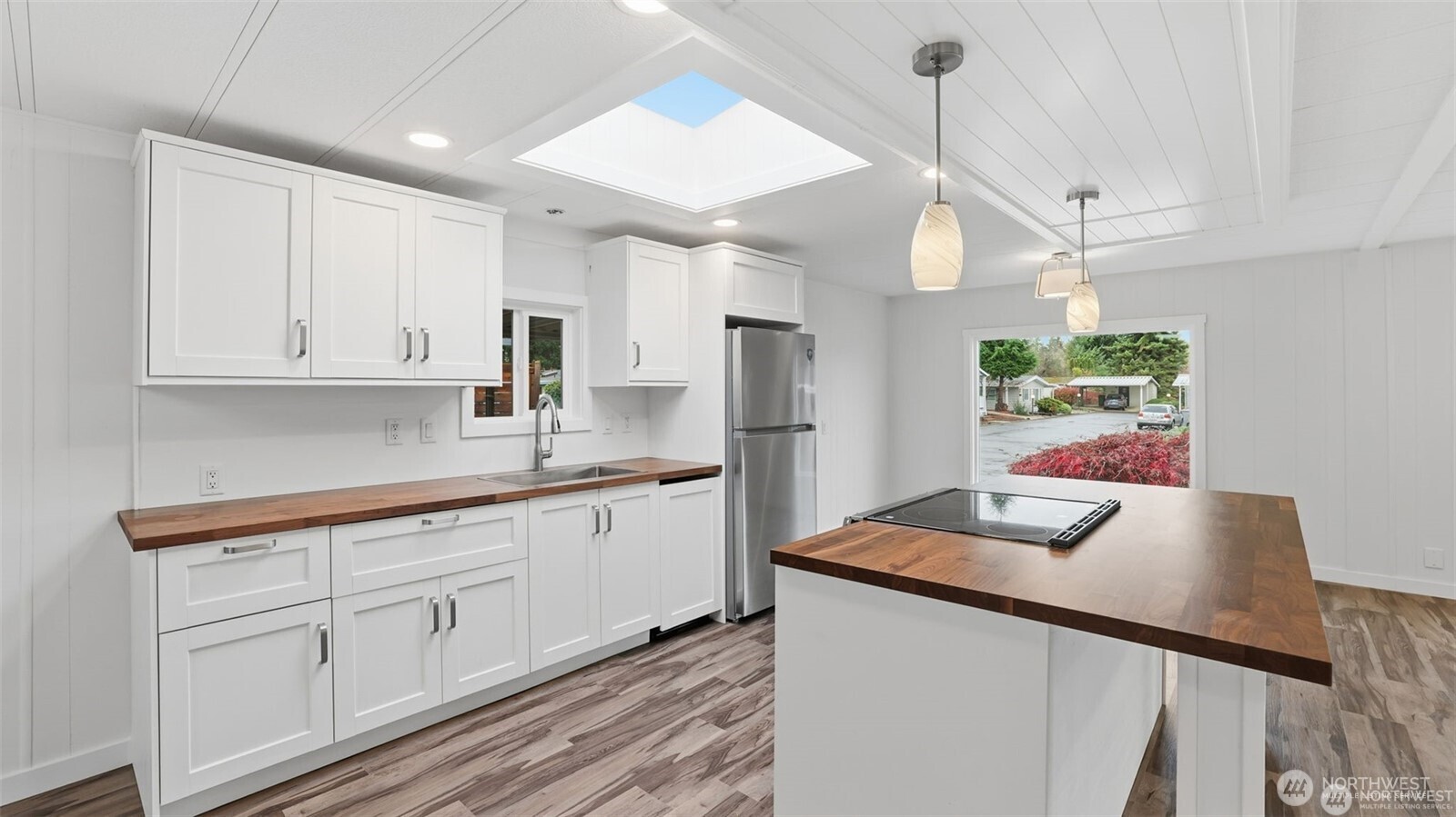 201 Union Avenue Southeast, Unit 247 Renton, WA 98059 - Photo 10 of 32 a kitchen with white cabinets and window
