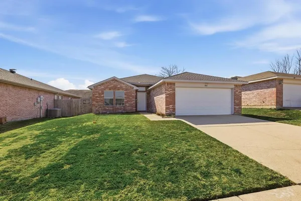 a view of a house with a yard and garage