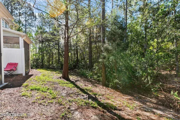 a back yard of a house with a yard