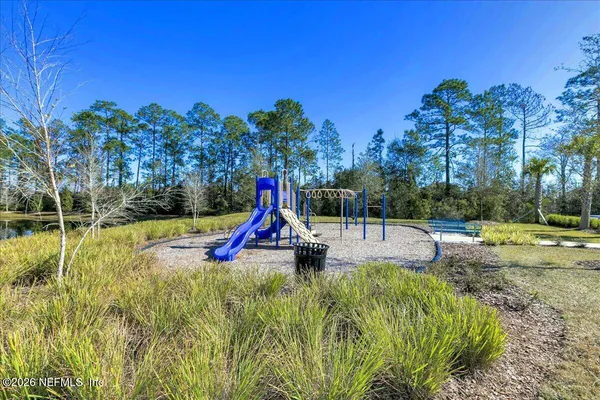 a view of a park with swings and slides
