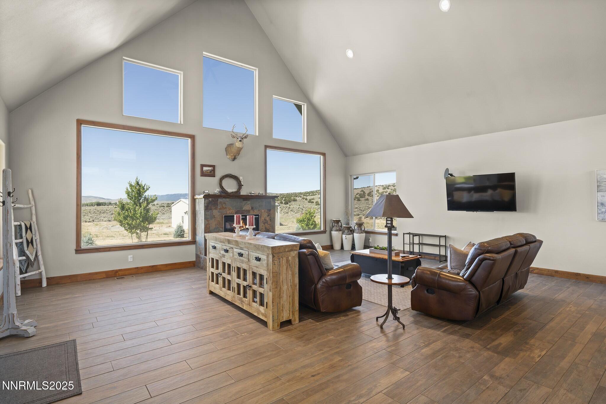 1240 Antelope Valley Road Reno, NV 89508 - Photo 14 of 60 a living room with furniture and a fireplace