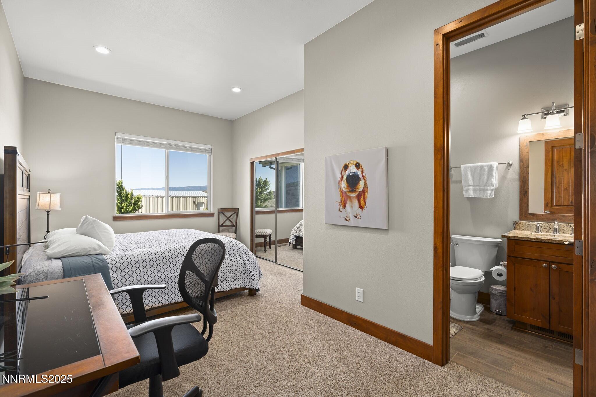 1240 Antelope Valley Road Reno, NV 89508 - Photo 16 of 60 a bedroom with furniture and a window