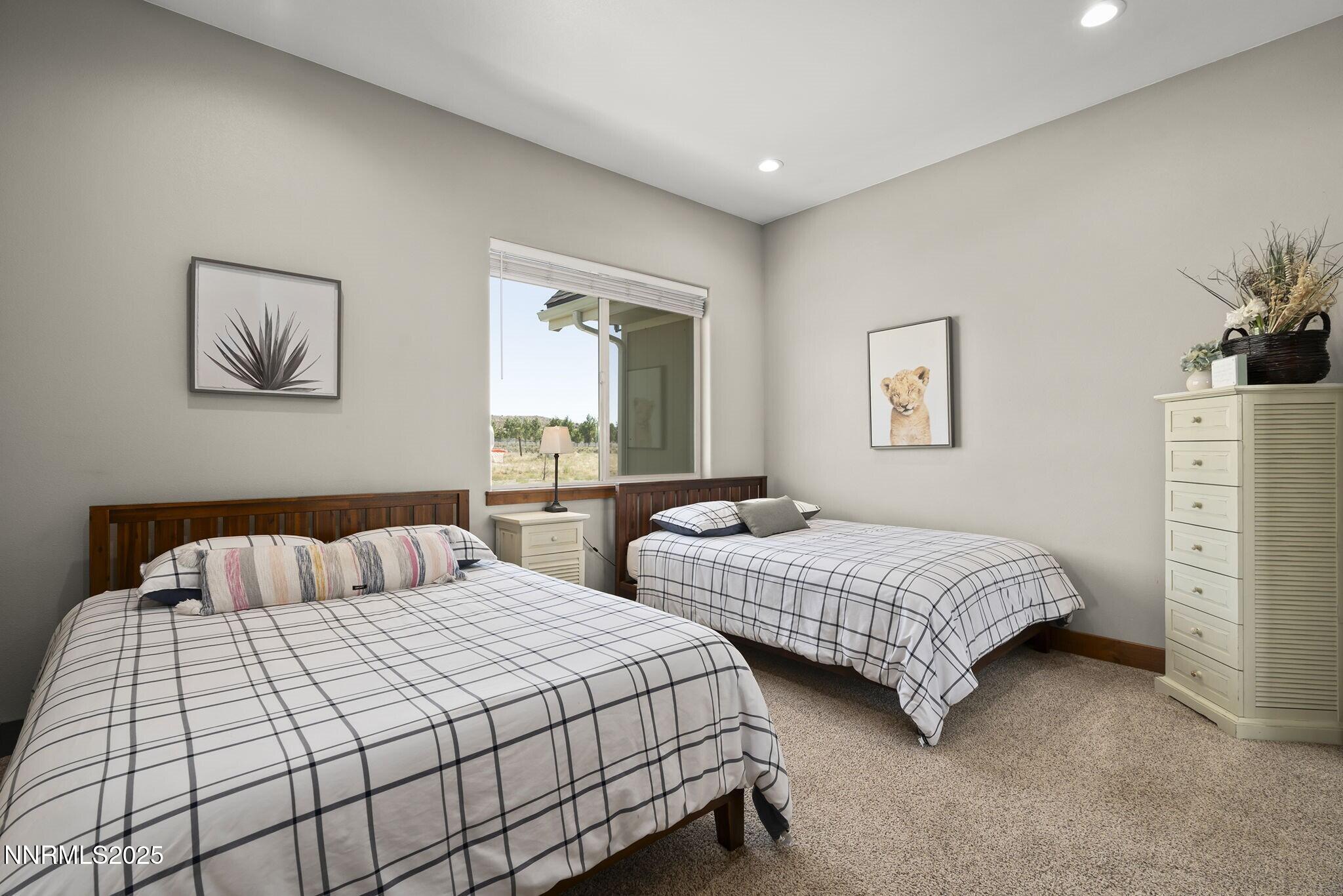1240 Antelope Valley Road Reno, NV 89508 - Photo 18 of 60 a bedroom with two beds and painting on the wall