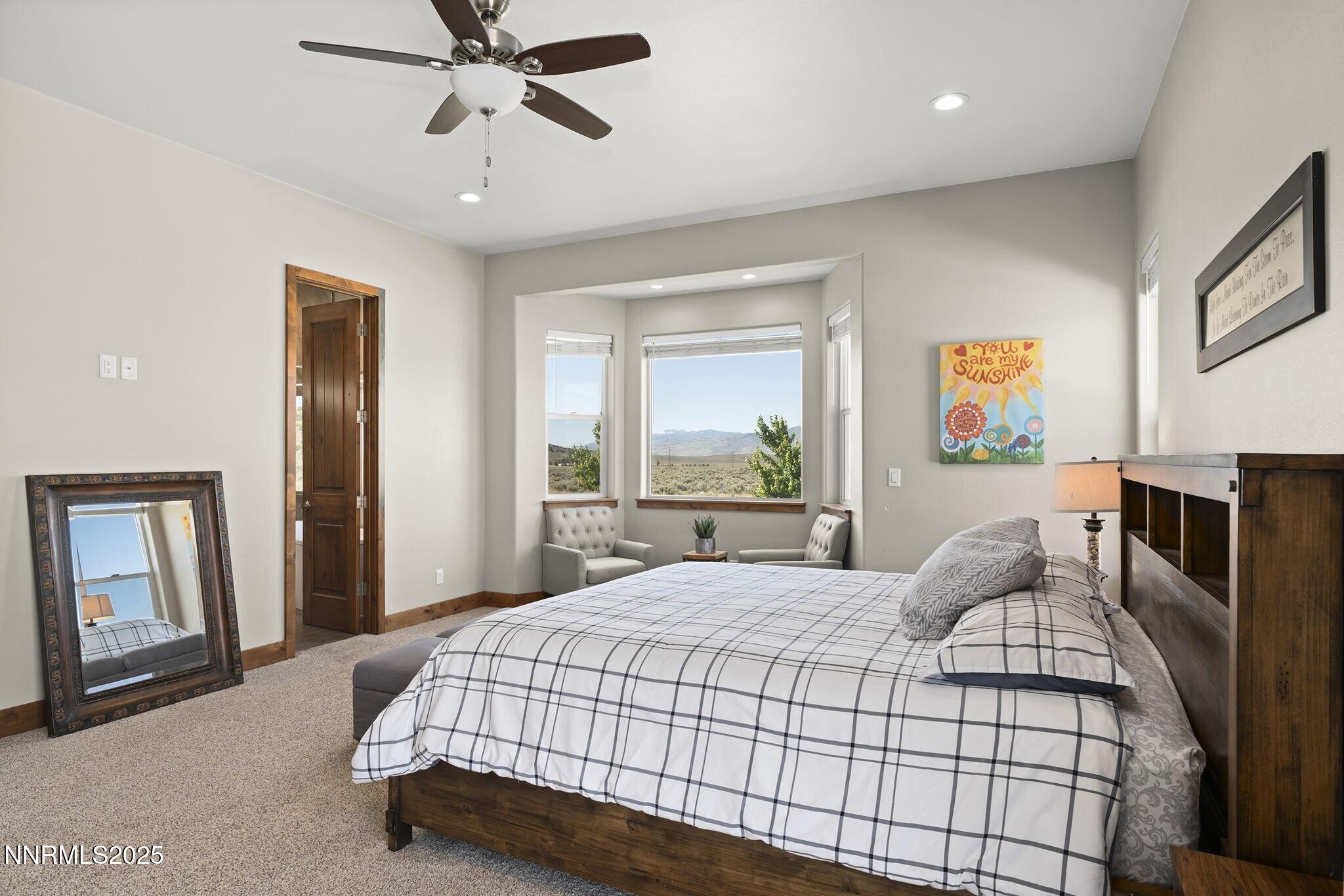 1240 Antelope Valley Road Reno, NV 89508 - Photo 22 of 60 a bedroom with a bed and dresser with mirror