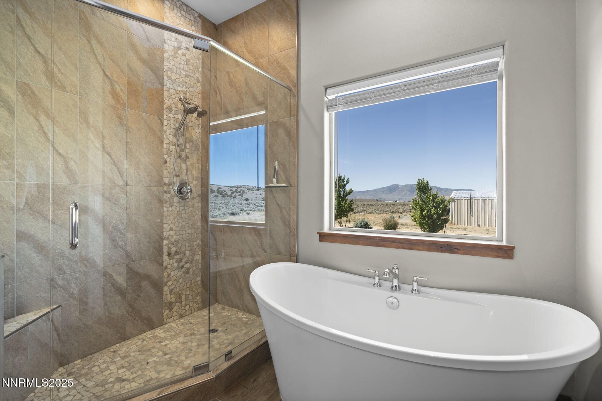 1240 Antelope Valley Road Reno, NV 89508 - Photo 23 of 60 a white bath tub sitting next to a small bathroom