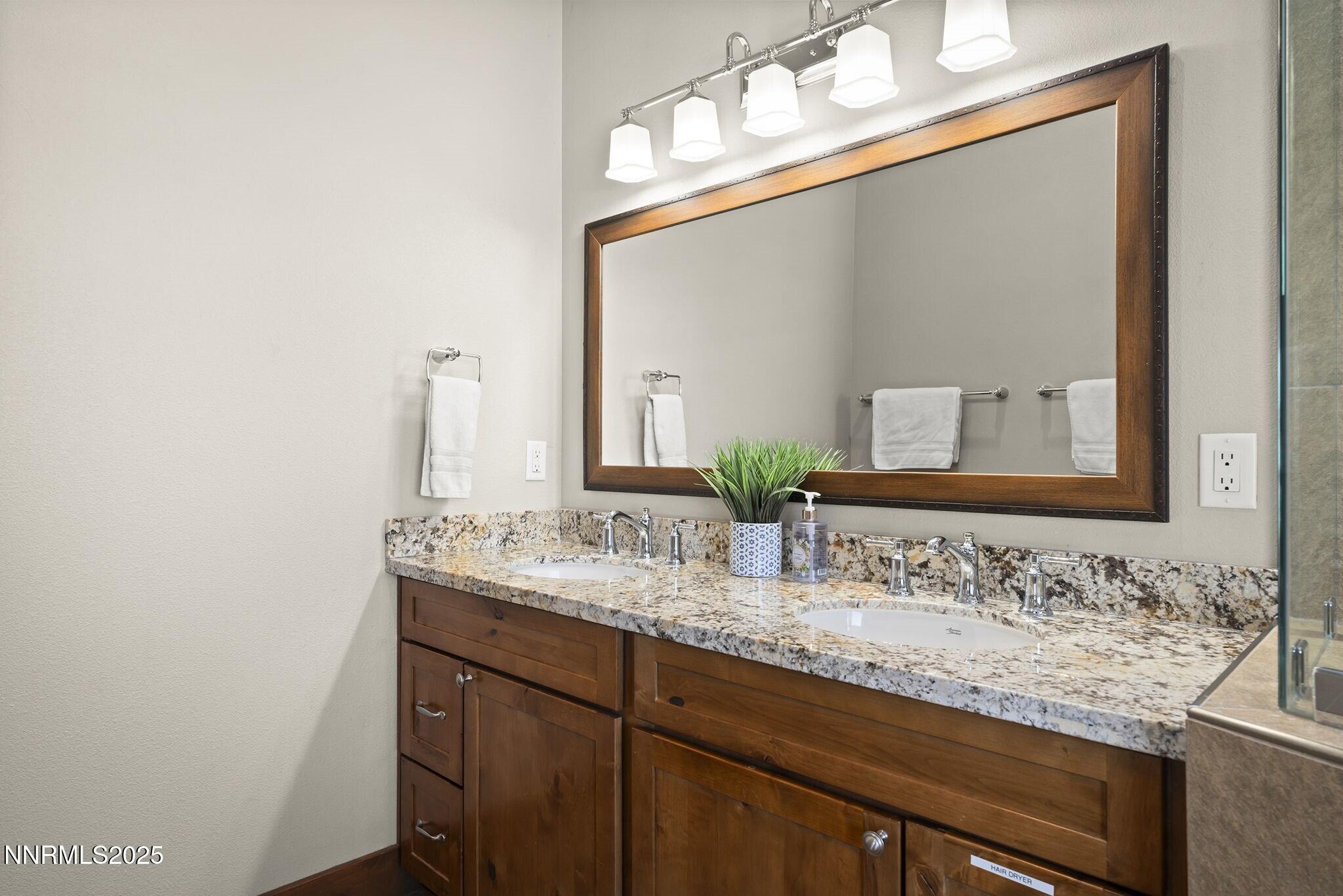 1240 Antelope Valley Road Reno, NV 89508 - Photo 24 of 60 a bathroom with a sink and a mirror