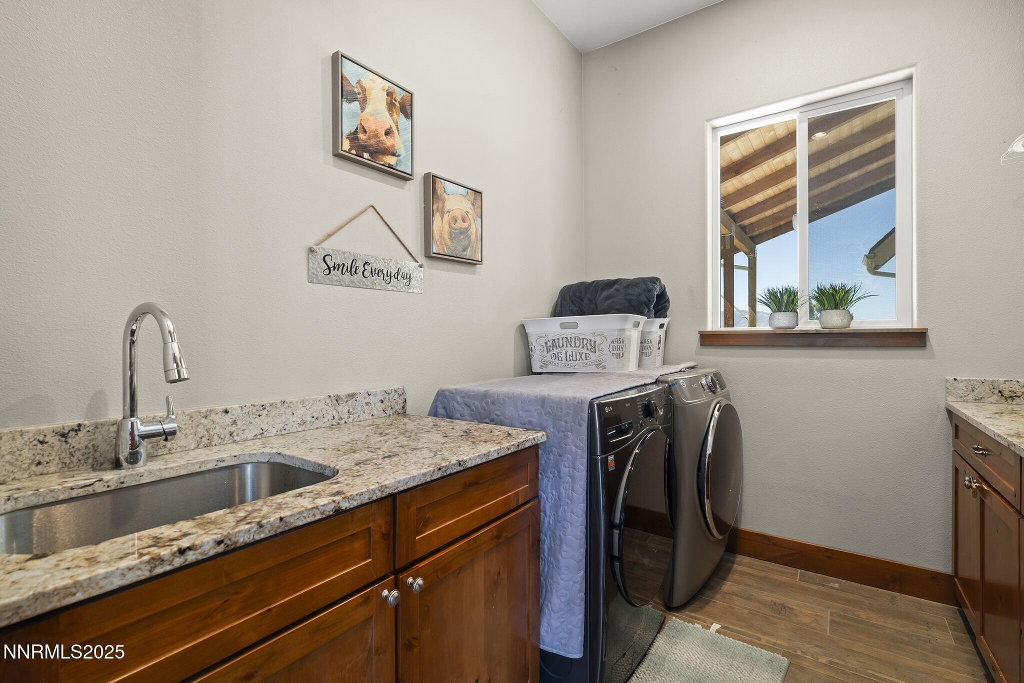 1240 Antelope Valley Road Reno, NV 89508 - Photo 27 of 60 a utility room with a sink dryer and washer