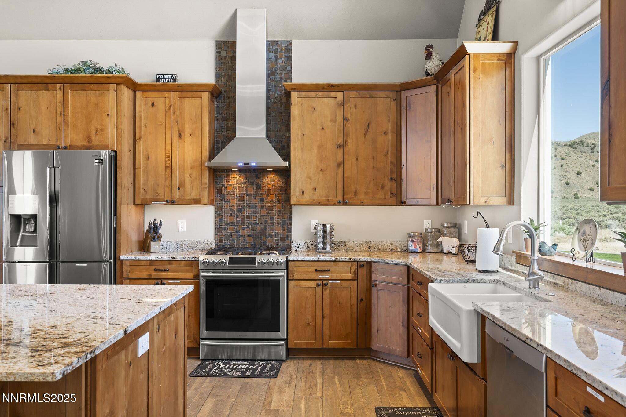 1240 Antelope Valley Road Reno, NV 89508 - Photo 3 of 60 a kitchen with stainless steel appliances granite countertop a sink stove and refrigerator