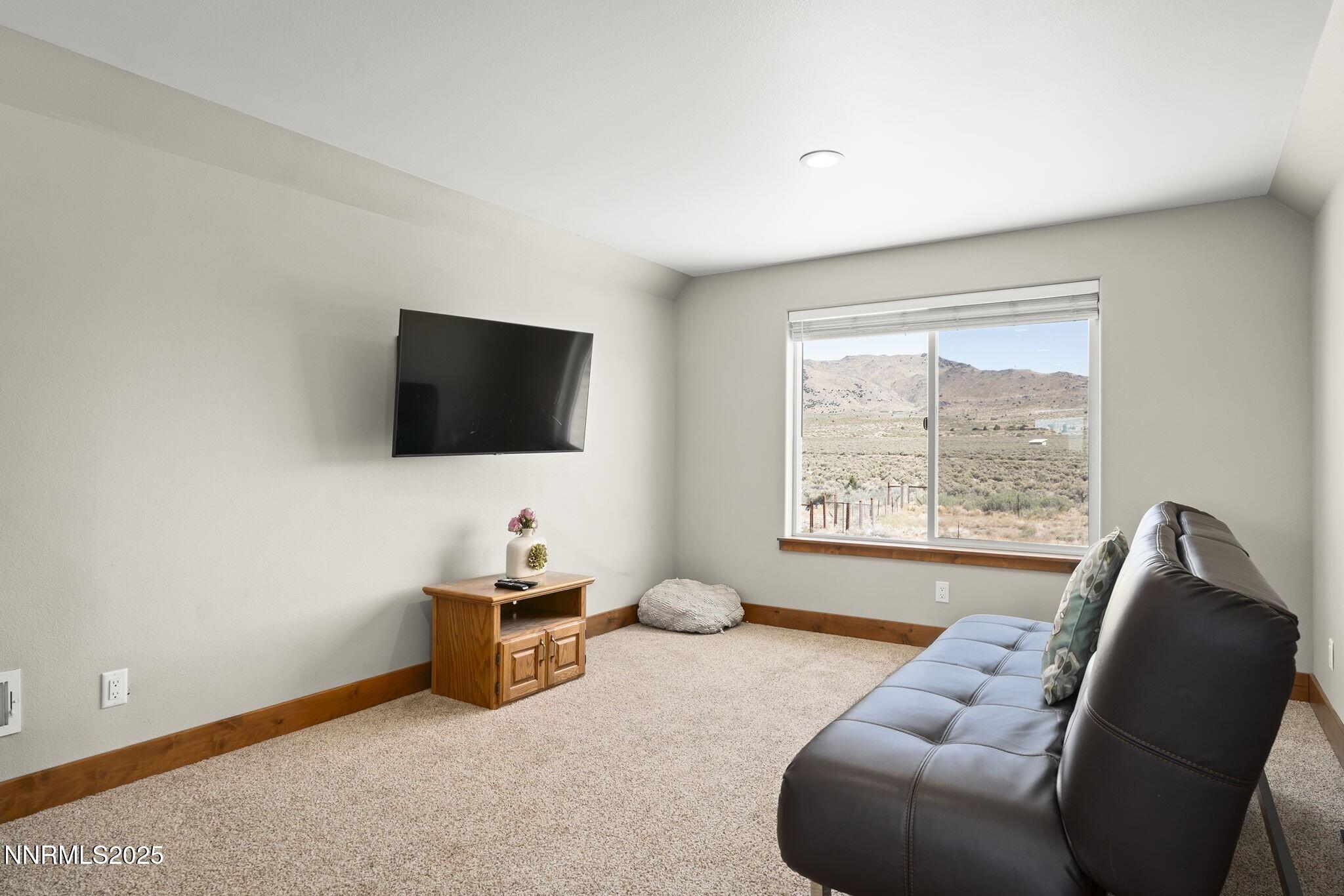 1240 Antelope Valley Road Reno, NV 89508 - Photo 30 of 60 a living room with furniture and a flat screen tv