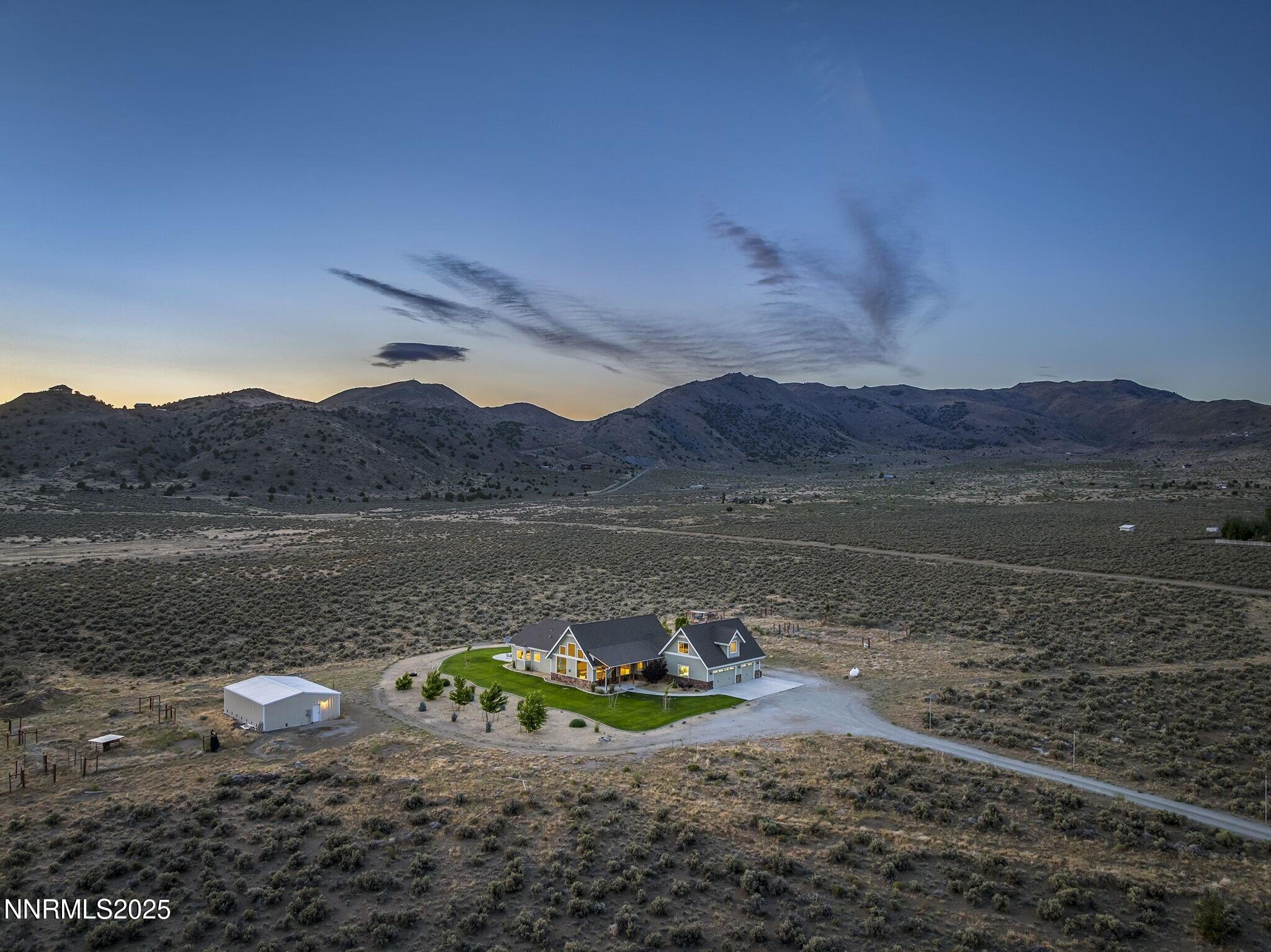 1240 Antelope Valley Road Reno, NV 89508 - Photo 39 of 60 a view of a lake with a mountain in the background