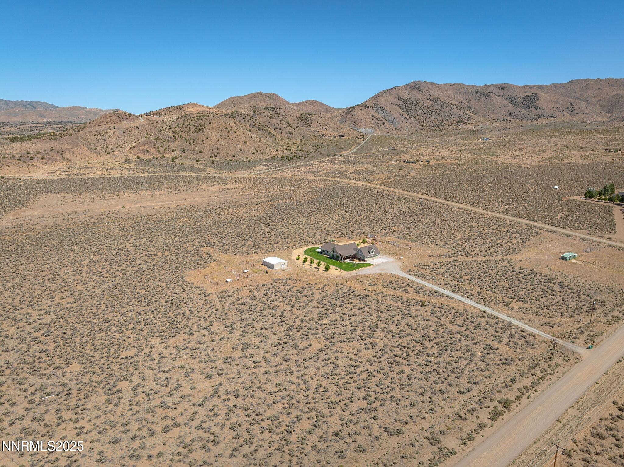 1240 Antelope Valley Road Reno, NV 89508 - Photo 57 of 60 a view of a backyard with mountain view