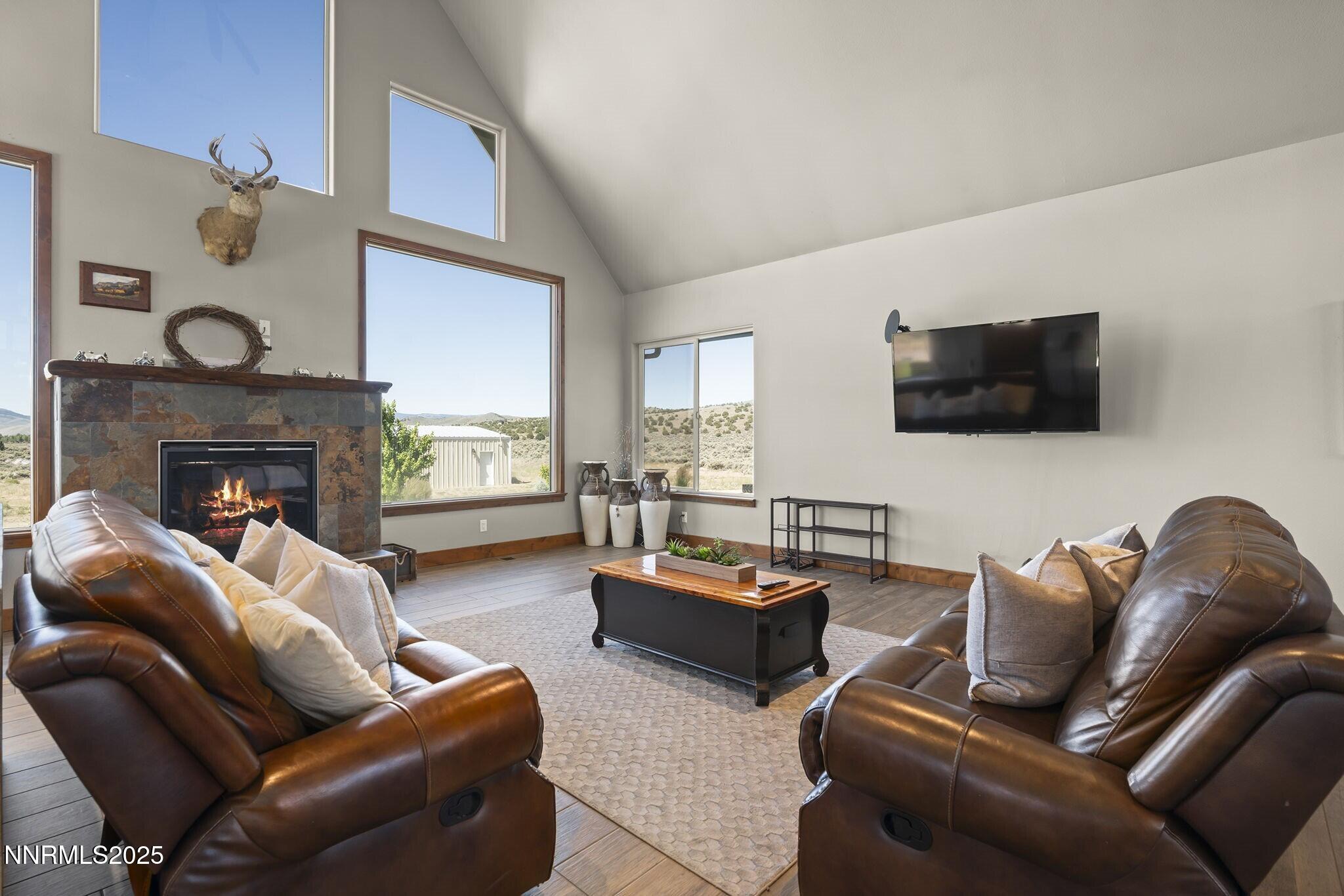1240 Antelope Valley Road Reno, NV 89508 - Photo 6 of 60 a living room with furniture and a flat screen tv