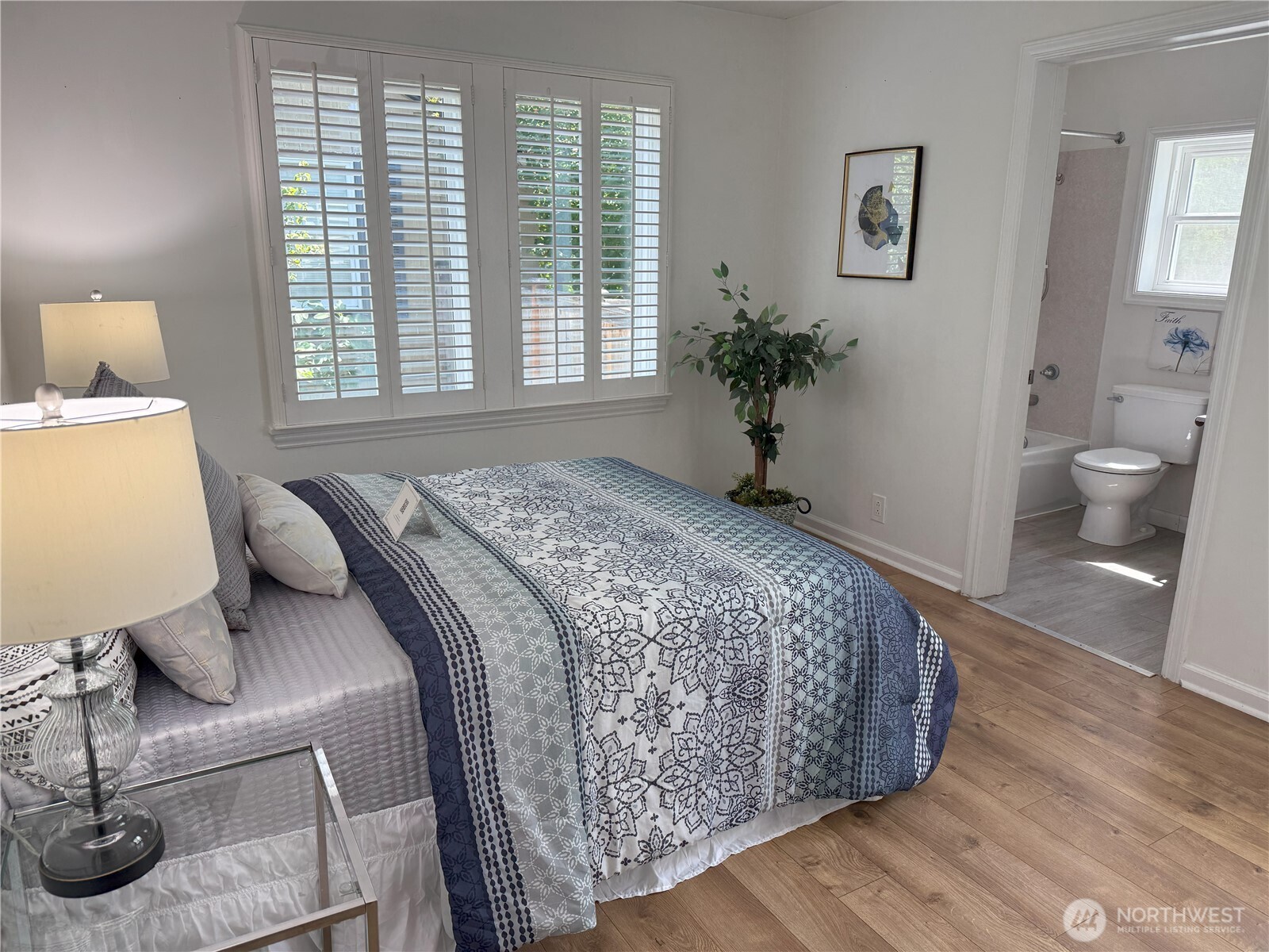 4329 Northeast 56th Street Seattle, WA 98105 - Photo 13 of 34 a bedroom with a bed and window