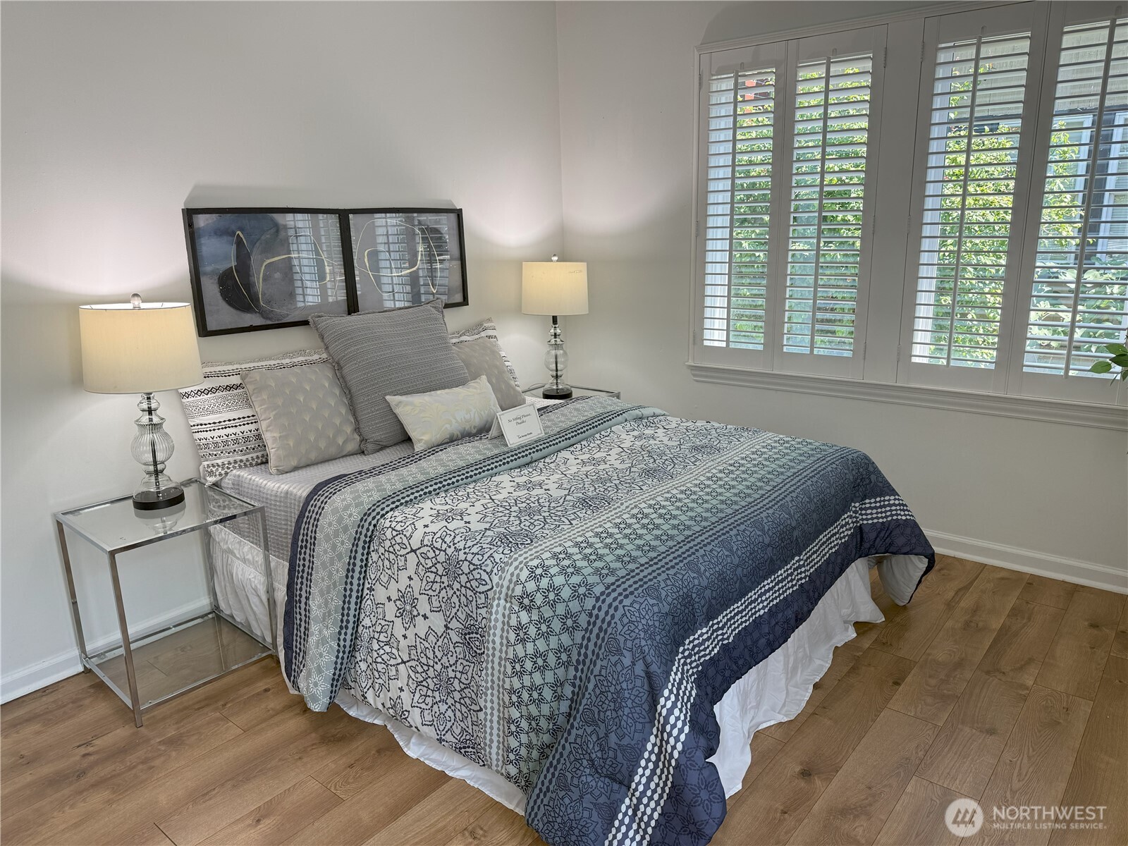 4329 Northeast 56th Street Seattle, WA 98105 - Photo 15 of 34 a bed sitting in a bedroom next to a window