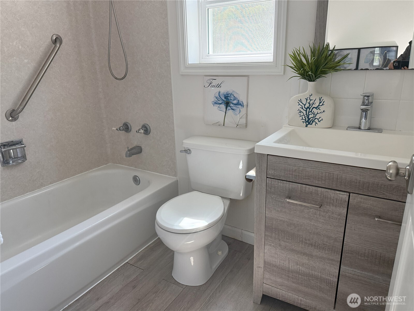 4329 Northeast 56th Street Seattle, WA 98105 - Photo 16 of 34 a bathroom with a sink toilet and shower