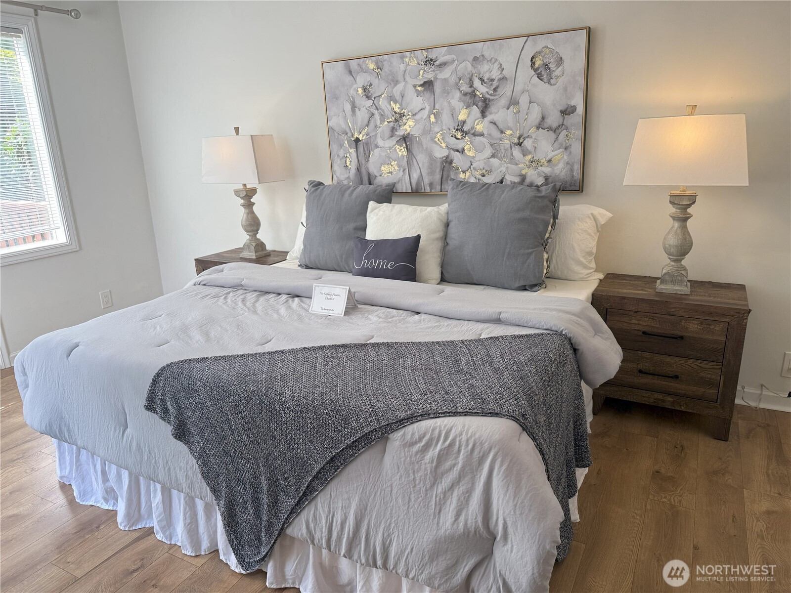 4329 Northeast 56th Street Seattle, WA 98105 - Photo 18 of 34 a bedroom with a bed and a lamp