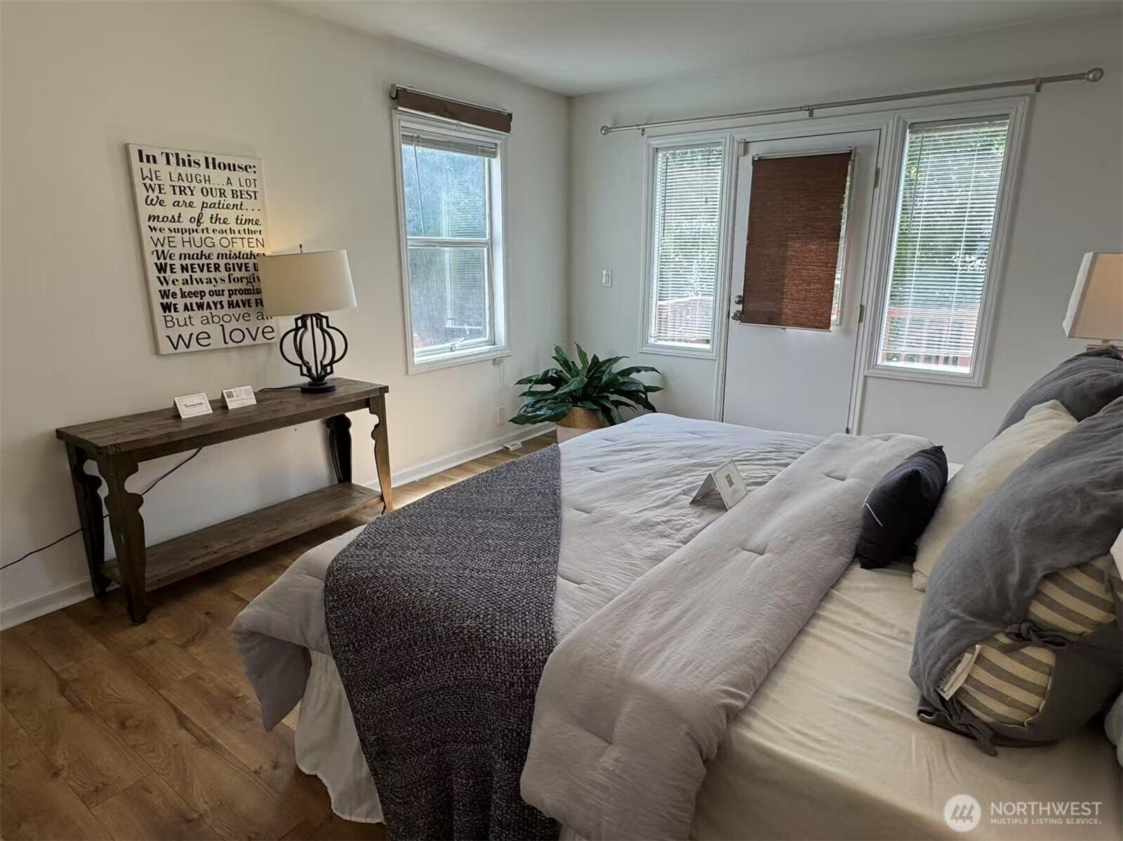 4329 Northeast 56th Street Seattle, WA 98105 - Photo 19 of 34 a bed sitting in a bedroom next to a window
