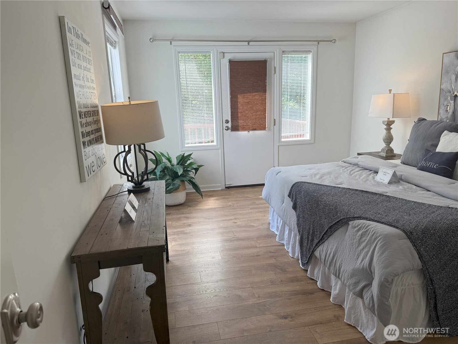 4329 Northeast 56th Street Seattle, WA 98105 - Photo 20 of 34 a bedroom with a bed window and potted plant