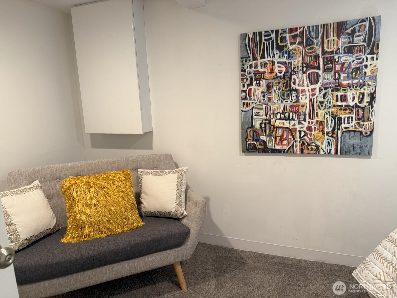 4329 Northeast 56th Street Seattle, WA 98105 - Photo 24 of 34 closeup of the couch with wooden floor
