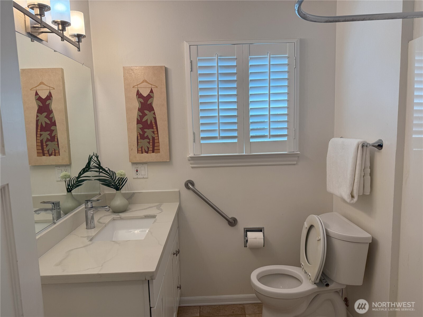 4329 Northeast 56th Street Seattle, WA 98105 - Photo 25 of 34 a bathroom with a sink a toilet and a mirror