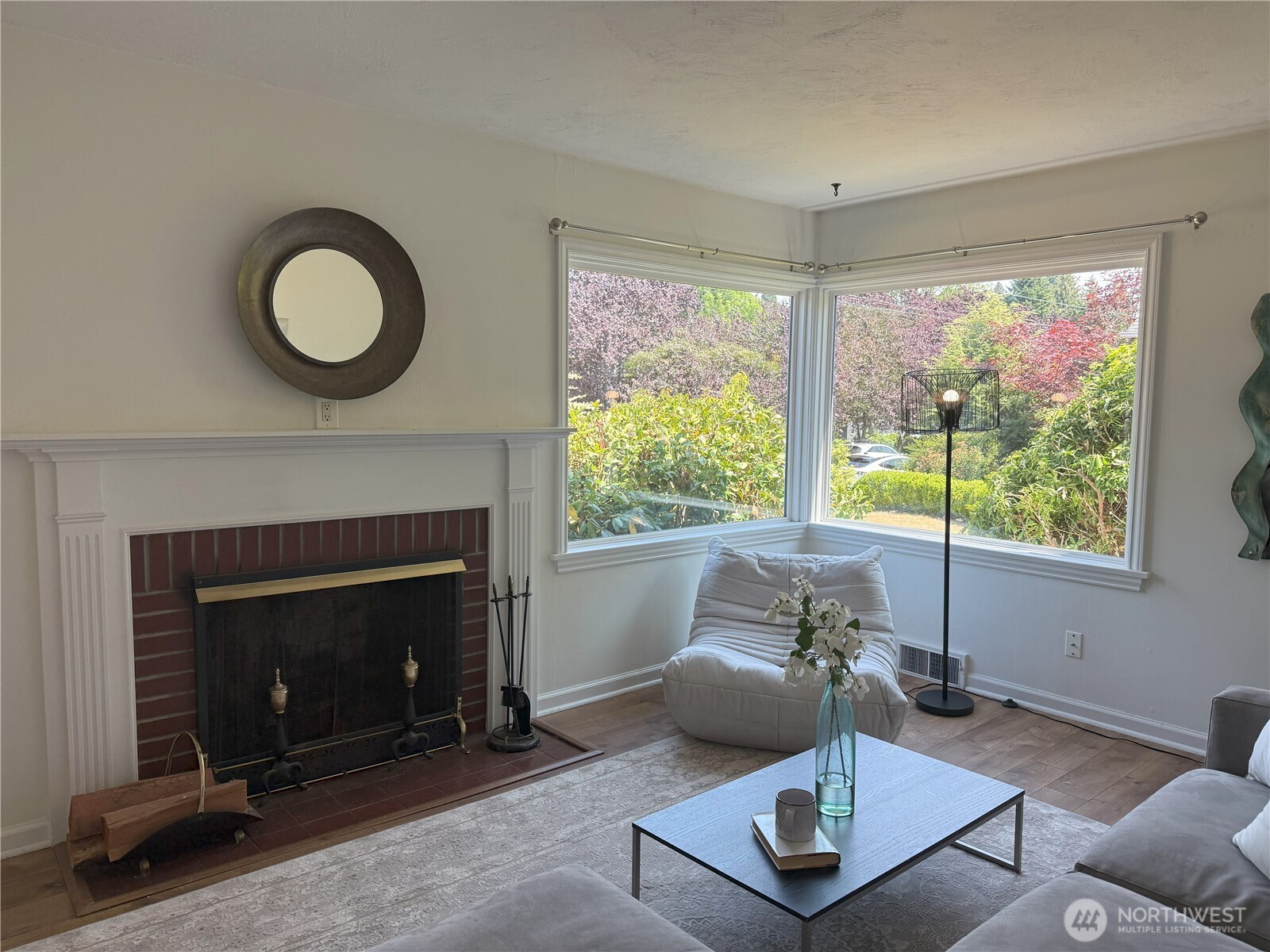 4329 Northeast 56th Street Seattle, WA 98105 - Photo 4 of 34 a living room with furniture and a fireplace