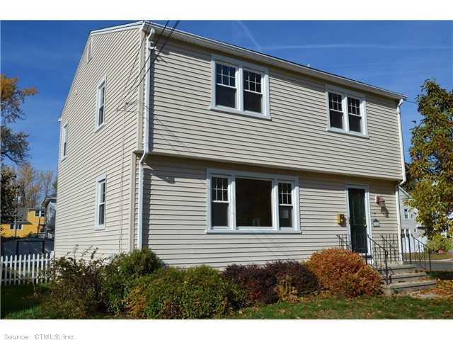 110 Rochford Avenue Hamden, CT 06514 - Photo 1 of 1 a front view of a house with a garage