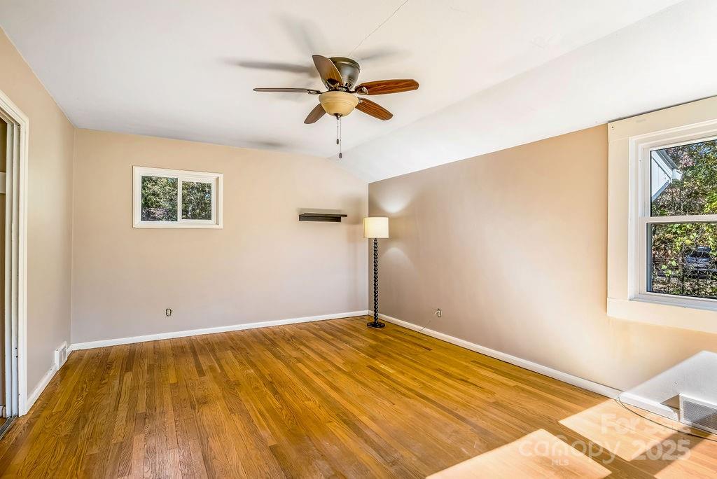145 Beverly Road Asheville, NC 28805 - Photo 29 of 45 a view of a room with a window and ceiling fan