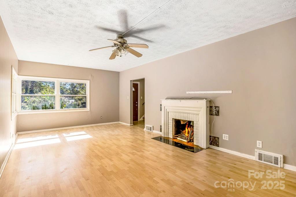 145 Beverly Road Asheville, NC 28805 - Photo 32 of 45 a view of living room with furniture and a fireplace